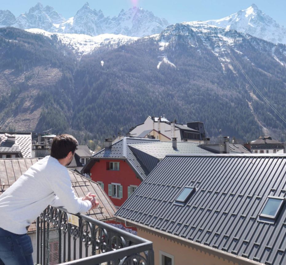 Apartment with man on balcony mountain view lifestyle chamonix