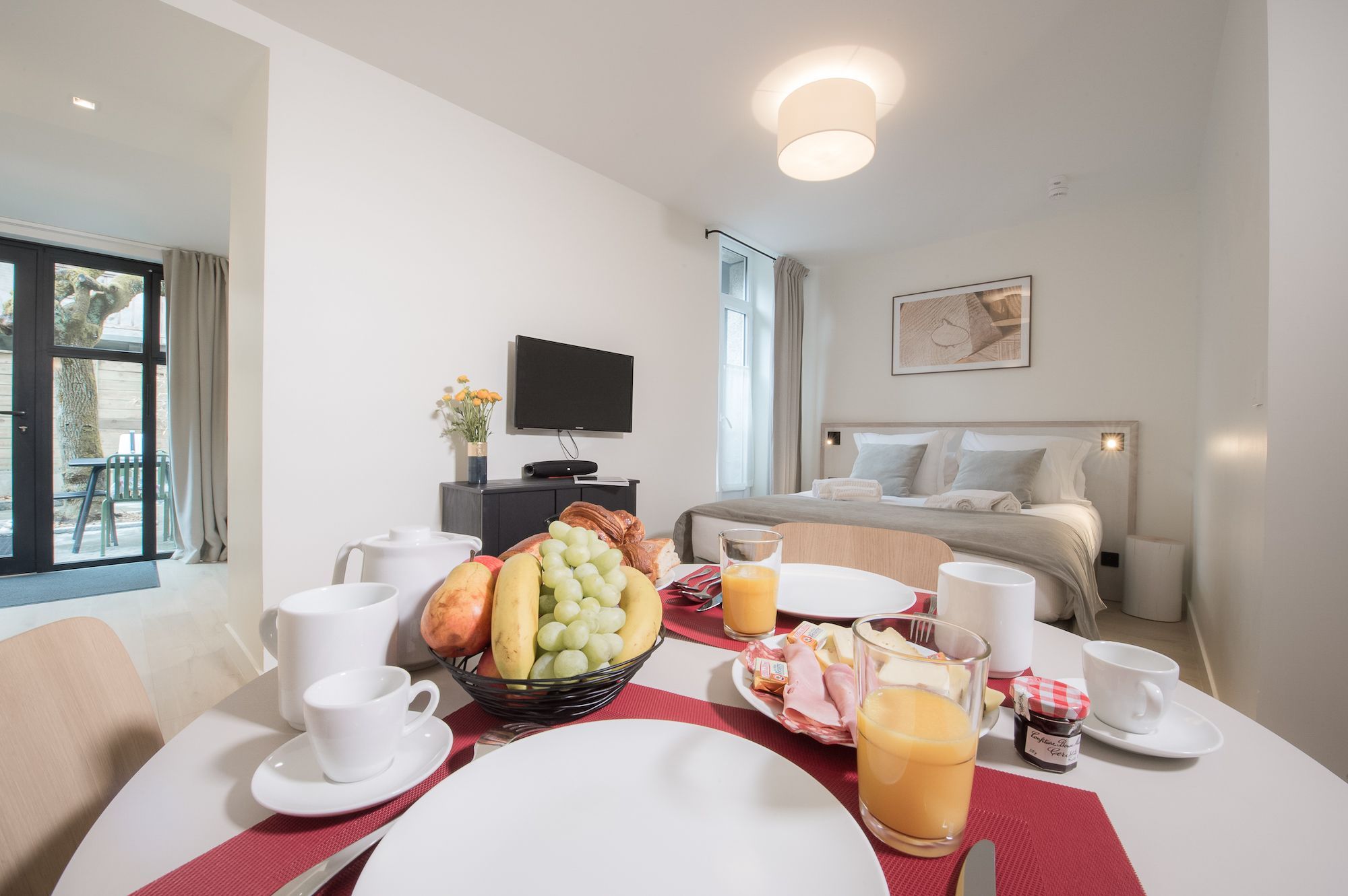 breakfast table in studio with double bed