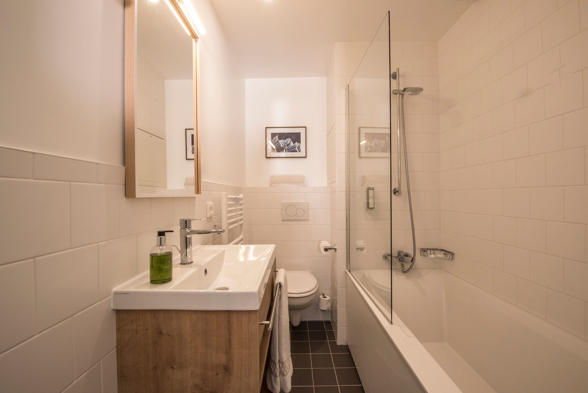 bright bathroom with bathtub in 2-room apartment