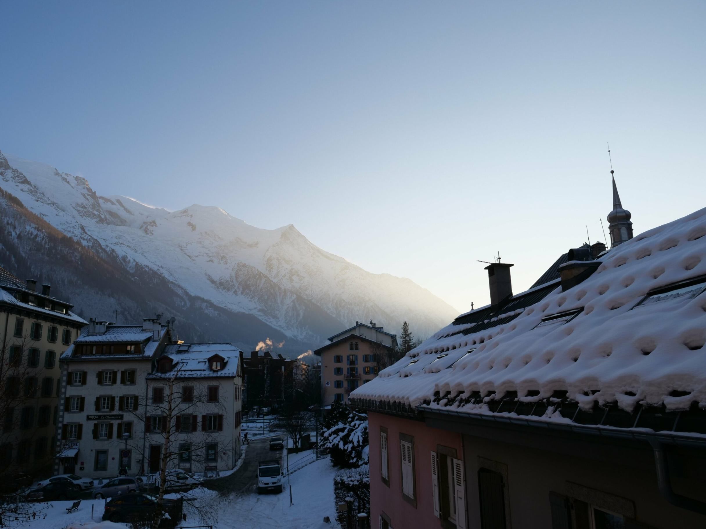 Hotel Faucigny with snow-covered roofs and views of Mont Blanc