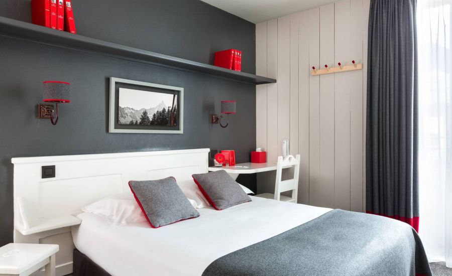 standard red and grey bedroom with comfy bed